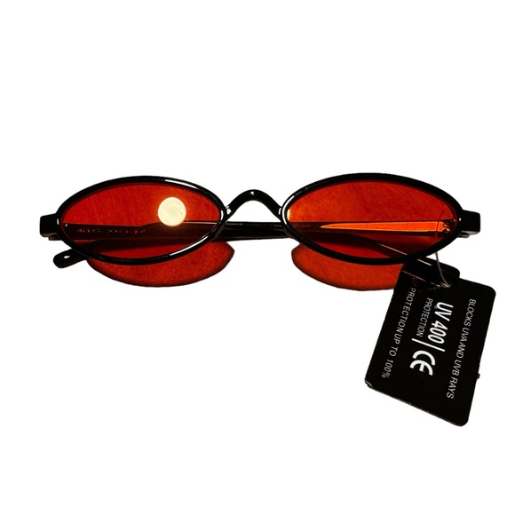 Women’s Black Frame Orange Lens Slim Oval Sunglasses - Picture 1 of 3
